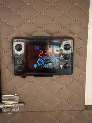 a digital clock on a wall with a gun at PaRina in Vilnius
