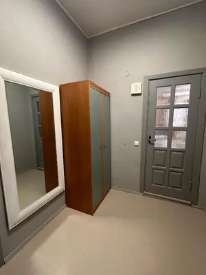an empty room with a door and a mirror at Užupio apartamentai Nemokamas parkingas 3 in Vilnius