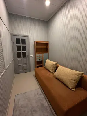 a room with a bed in a room with a door at Užupio apartamentai Nemokamas parkingas 3 in Vilnius