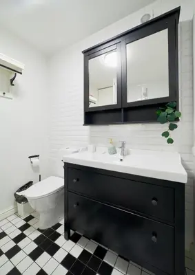a bathroom with a sink and a toilet at Town Hall Apartments FREE Parking in Vilnius