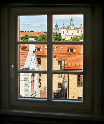 a window view of a city from a building at Town Hall Apartments FREE Parking in Vilnius