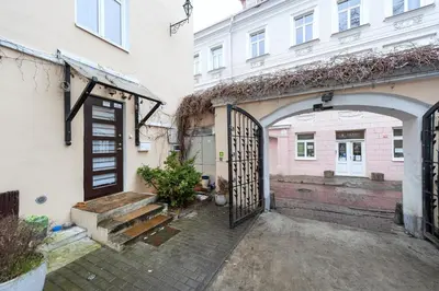 an entrance to a building with an open gate at President Apartments in Vilnius