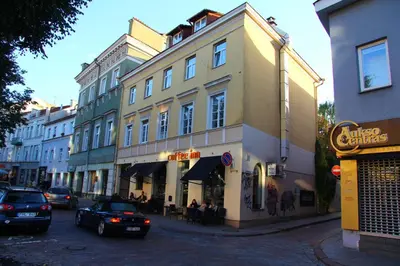 a street with cars parked in front of a building at German18-3A Luxury Vilnius apartment in Vilnius