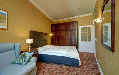 a bedroom with a bed and a couch at German18-3A Luxury Vilnius apartment in Vilnius