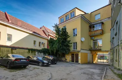 a group of cars parked in front of a building at German18-3A Luxury Vilnius apartment in Vilnius