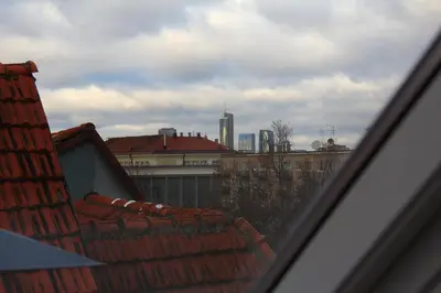 a view of the roofs of buildings in a city at German18-3B Luxury Vilnius apartment in Vilnius