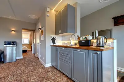 a kitchen with gray cabinets and a counter top at German18-3B Luxury Vilnius apartment in Vilnius