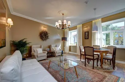 a living room with a white couch and a table at German18-3B Luxury Vilnius apartment in Vilnius
