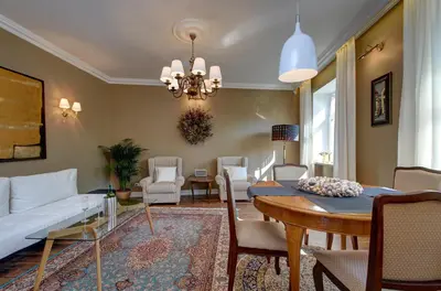 a living room with a white couch and a table at German18-3B Luxury Vilnius apartment in Vilnius