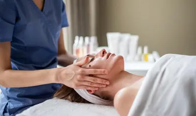 a woman getting a massage from a therapist at UPA Medical SPA in Druskininkai