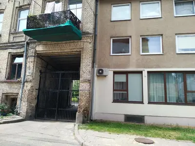 a building with a door with a balcony on it at Apartamentai 555 in Vilnius