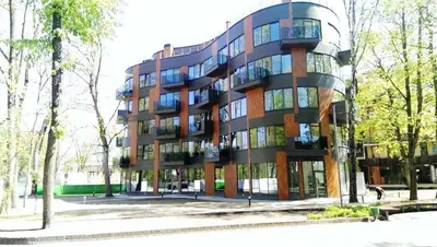 a large building with a lot of windows at Saulės Sonata Etude in Druskininkai