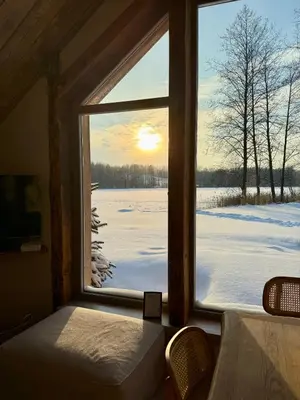 a window in a room with a view of a snow covered field at Dabintos slėnis in Sumiliszki