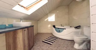 a bathroom with a tub and a toilet and a sink at Sodybos kompleksas - ECO Resort Trakai in Antakalnis