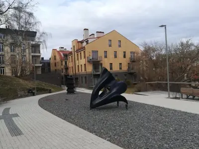 a sculpture of a pair of black shoes in a park at Apartment Vilnius Old Town in Vilnius