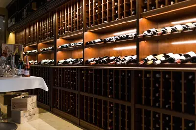 a wine cellar with a bunch of wine bottles at Harmony Park Countryside Villas & SPA in Prienai