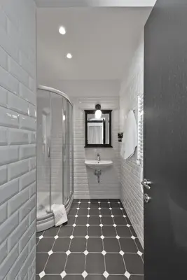 a bathroom with a sink and a shower at 15th Avenue in Vilnius