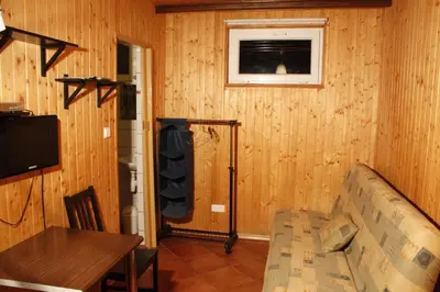 a living room with a couch and a table at The Jolly Man in Vilnius