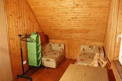 a room filled with boxes in a wooden room at The Jolly Man in Vilnius