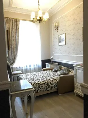a hotel room with a bed and a window at Gabi B&B in Vilnius