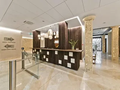 a lobby of a hotel with a reception desk at Aqua Center Apartments in Druskininkai