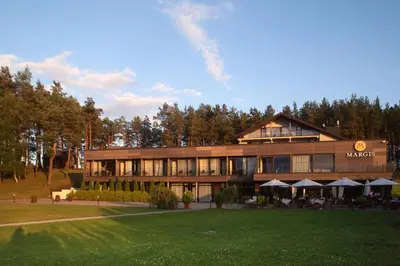 a large building with a restaurant in front of it at Margis Hotel & SPA in Trakai