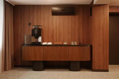 a counter with a coffee maker on top of it at AIRINN Vilnius Airport Hotel RENOVATED 2025 in Vilnius