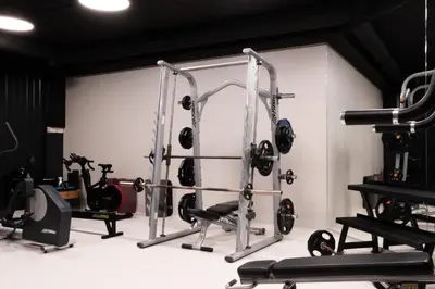 a gym with several tread machines and weights at AIRINN Vilnius Airport Hotel RENOVATED 2025 in Vilnius
