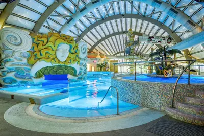 a water slide at a theme park with a pool at Grand SPA Lietuva Hotel Druskininkai in Druskininkai