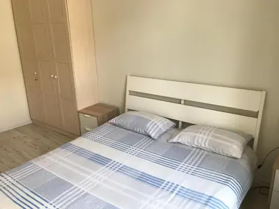 a bedroom with a bed with two pillows at Igo apartment Uzupis in Vilnius