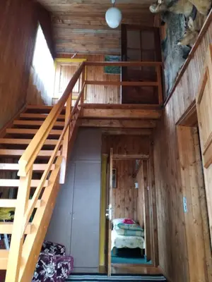 an attic room with a staircase and a bedroom at 