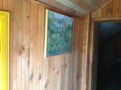 a painting hanging on the wall of a house at 