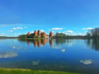 a castle on an island in the middle of a lake at 