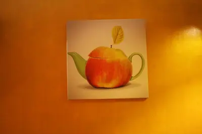 a painting of an apple on a wall at Prie Miesto Vartų in Vilnius