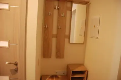 a bathroom with a cross hanging on the wall at Šeimyninis butas in Birštonas