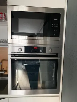 a stainless steel oven with a microwave in a kitchen at Angel in Druskininkai