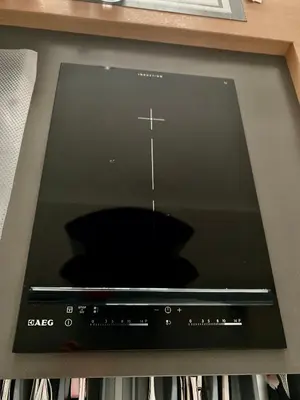 a tablet computer with a cross on the screen at Angel in Druskininkai