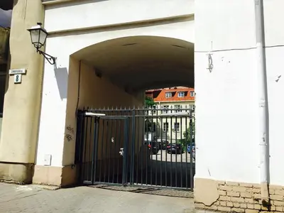 an entrance to a building with a black gate at Apartment Vilnius Zemaitijos in Vilnius