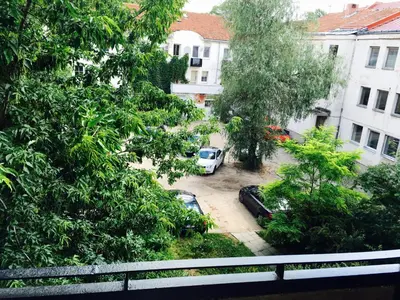 a view of a parking lot with cars in a yard at Apartment Vilnius Zemaitijos in Vilnius