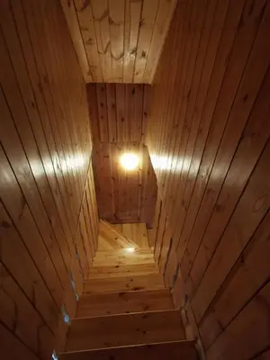 an overhead view of a wooden sauna with a light at Namelis su pirtele in Druskininkai
