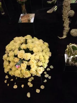 a bouquet of white roses sitting on a table at Kotedžai Milikonių g. in Kaunas