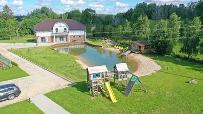 an aerial view of a park with a playground at Auroradream in Motiejiškės