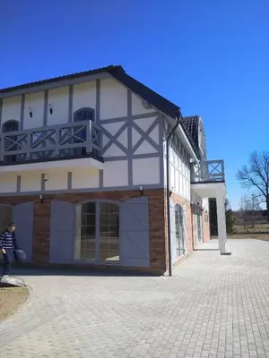a building with a balcony on top of it at Auroradream in Motiejiškės