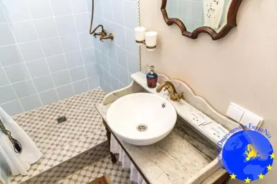 a bathroom with a sink and a mirror at Pakruojis Manor's Palace Boutique Hotel in Pakruojis