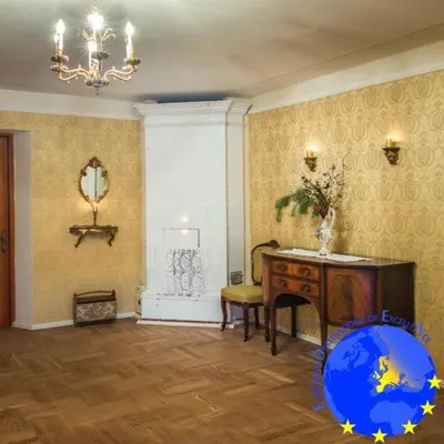 a room with a desk and a table and a mirror at Pakruojis Manor's Palace Boutique Hotel in Pakruojis