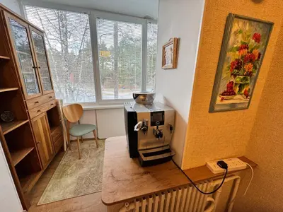 a small kitchen with a stove in a room at VIsagino Apartment in Visaginas