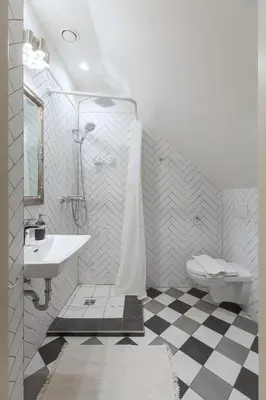 a white bathroom with a sink and a toilet at Apartments Satva in Vilnius