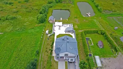 an overhead view of a large white house with a barn at MS Resort in Nemėžis
