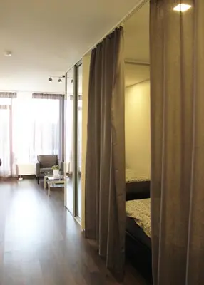 a room with a bedroom with a bed and a window at New Studio In Oslo Namai in Vilnius