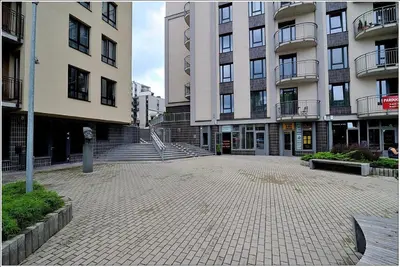 an empty parking lot in front of some buildings at New Studio In Oslo Namai in Vilnius